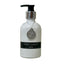 White bottle of Vanilla Cardamom wash with a black label on a light surface.