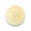 Round, beige-colored lotion bar on a white background